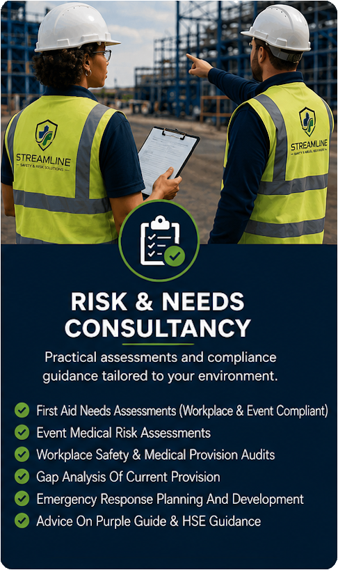 Two construction workers, wearing hard hats and high-visibility vests with a company's logo, are at a construction site. One is holding a clipboard and the other is pointing towards the site.
