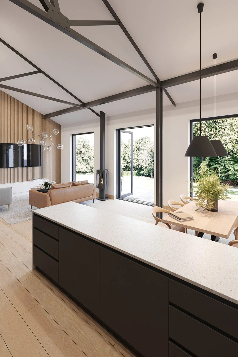 Modern open-concept living and dining area with a kitchen island, a tan sofa, a wall-mounted TV, a fireplace, and large windows showing greenery outside.