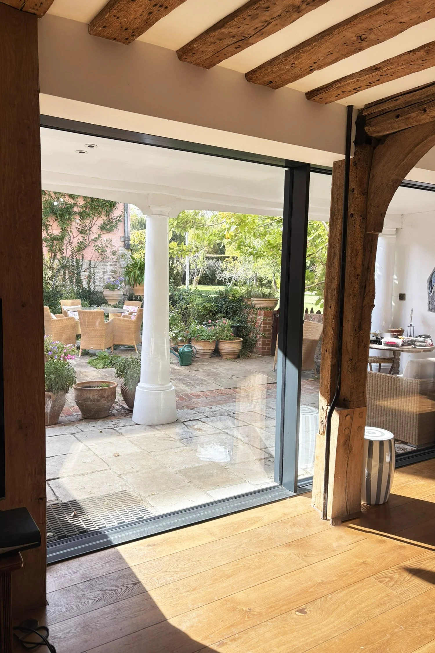 The kitchen view of the courtyard with large sliding glazed doors