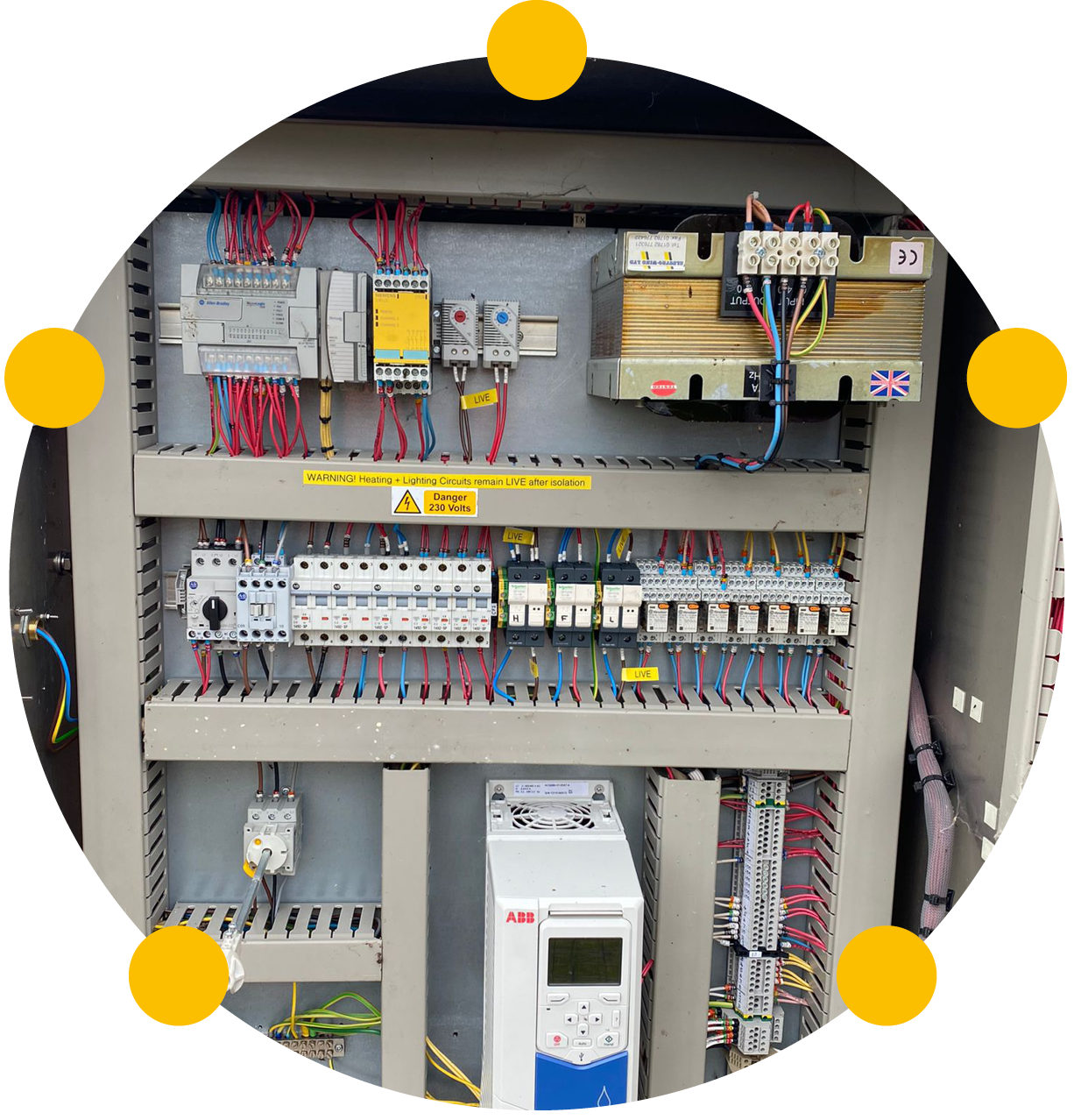 A circular image showing an electrical control panel