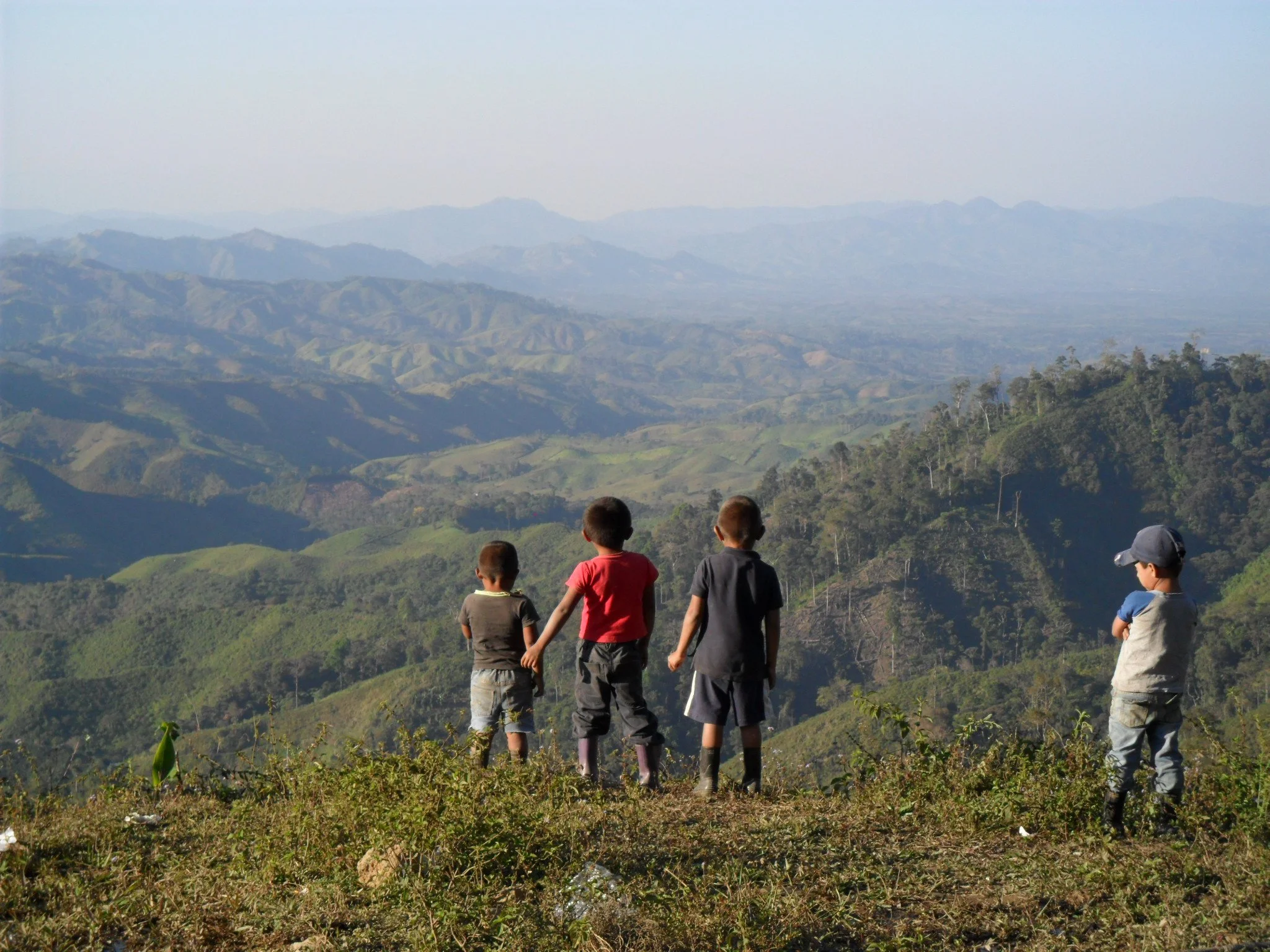 Children in Honduras overlook the countryside.