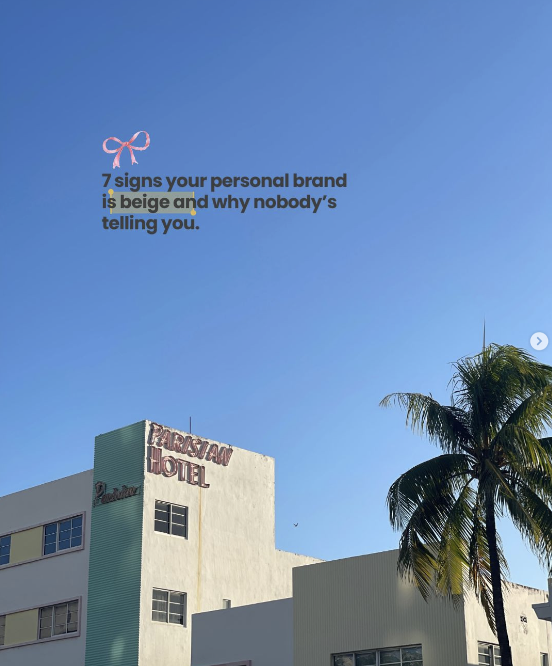 Blue sky with a pink ribbon bow and text that reads '7 signs your personal brand is beige and why nobody's telling you.' Part of a building with a sign that says 'Parisan Hotel' and a palm tree.