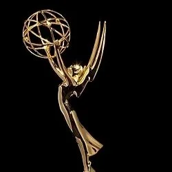 An Emmy award statue, featuring a gold figure holding an atom.