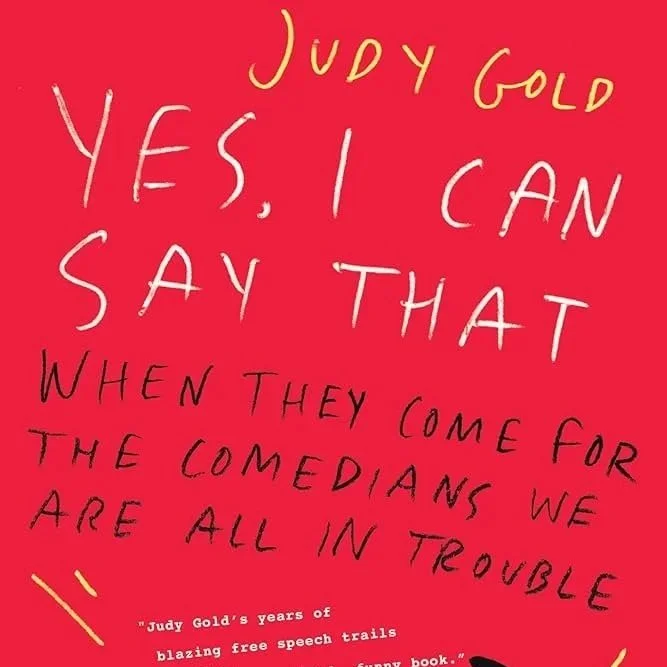 Red background with yellow and white handwritten text that reads: 'Judy Gold' at the top, 'Yes, I can say that' in the middle, and a quote at the bottom about comedians and trouble.
