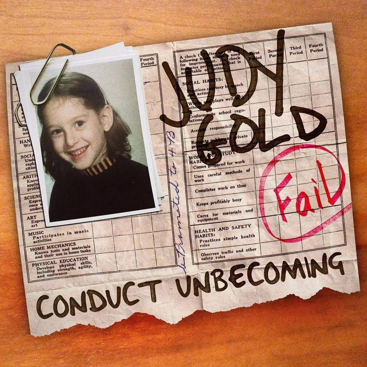 A school report card, marked with a red "Fail" stamp. A young girl’s portrait photo is clipped onto the report card with a paperclip, album cover of comedian Judy Gold's comedy album Content Unbecoming.