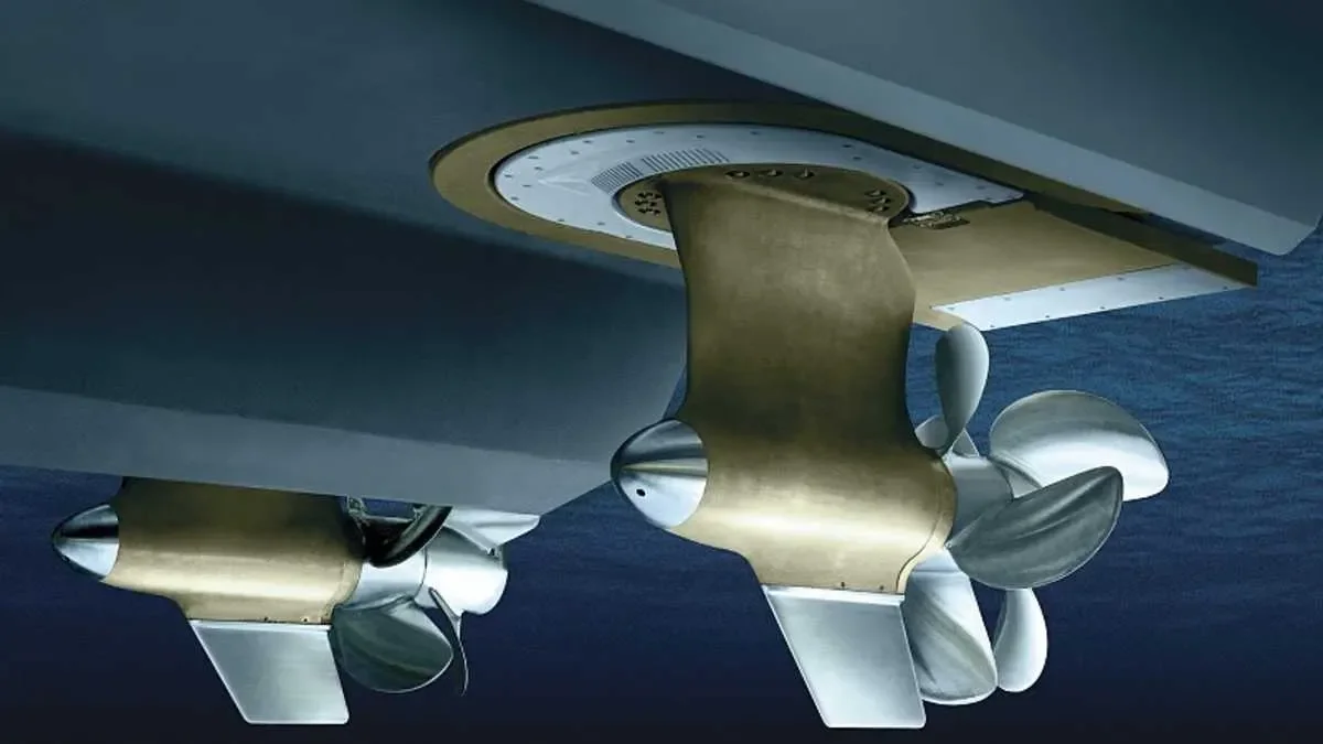 Two space capsules with metallic and gold coloring, floating in space or above the Earth.