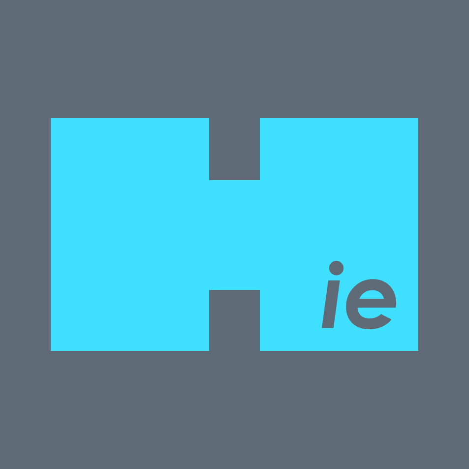 A puzzle piece logo with a blue puzzle piece and a gray background, featuring the lowercase letters 'ie' in gray at the bottom right of the puzzle piece.