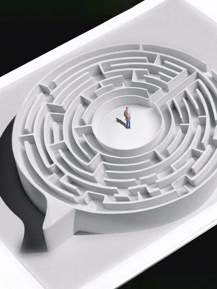 Miniature man standing inside a white, three-dimensional maze.