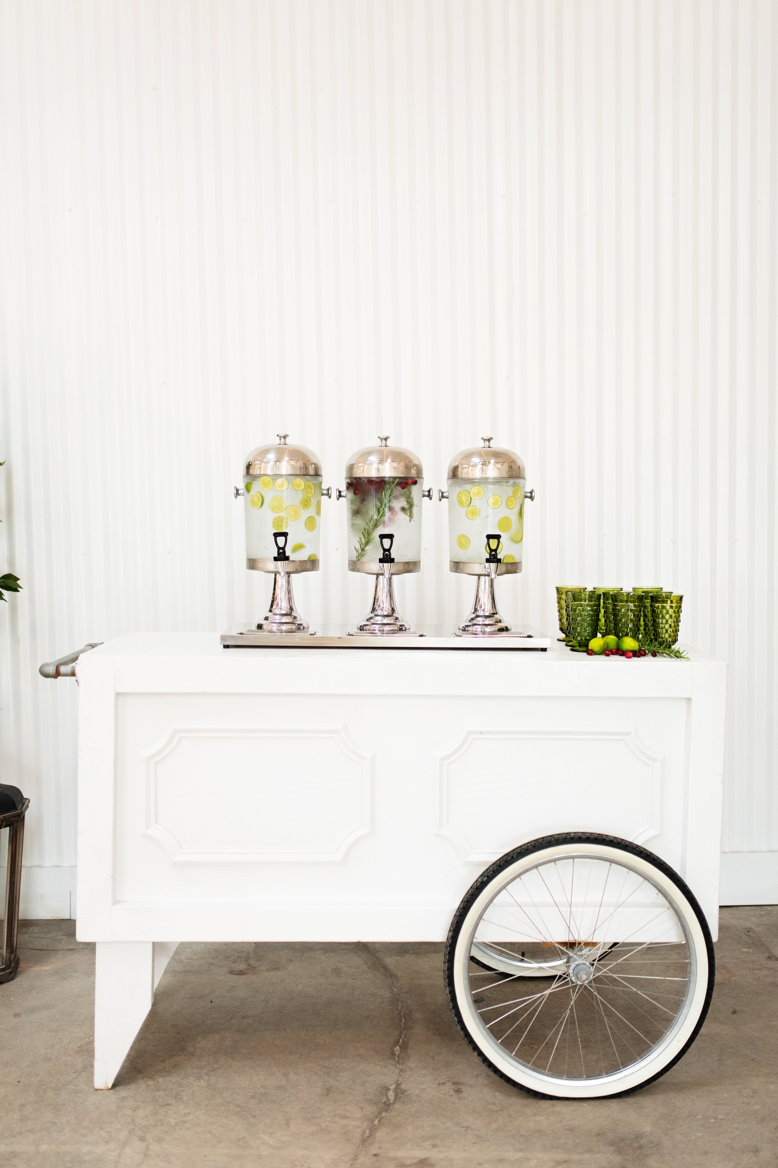 Drink Cart with rosemary, citrus, and cranberry infused water..
