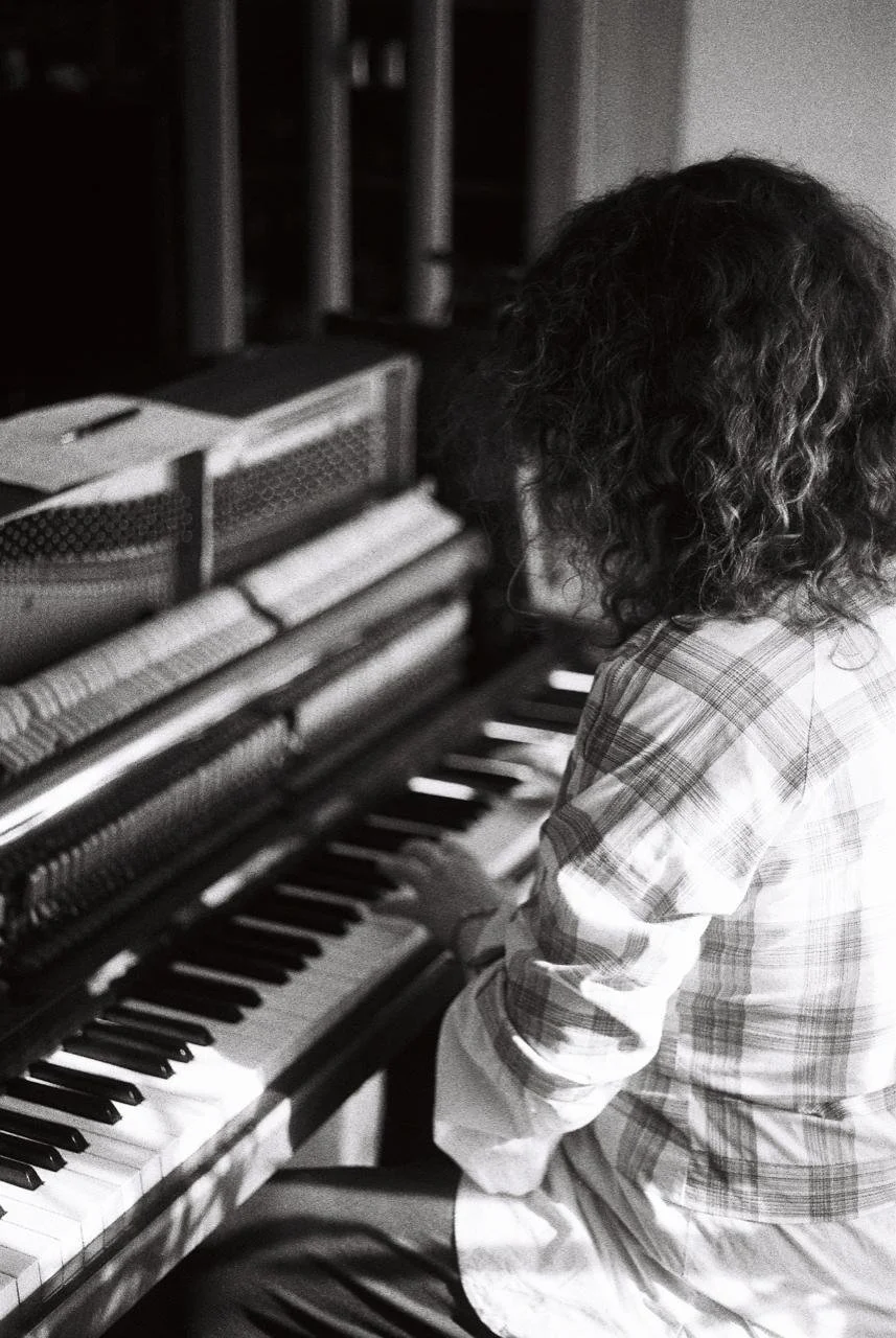 Woman Teaching Piano in London, England