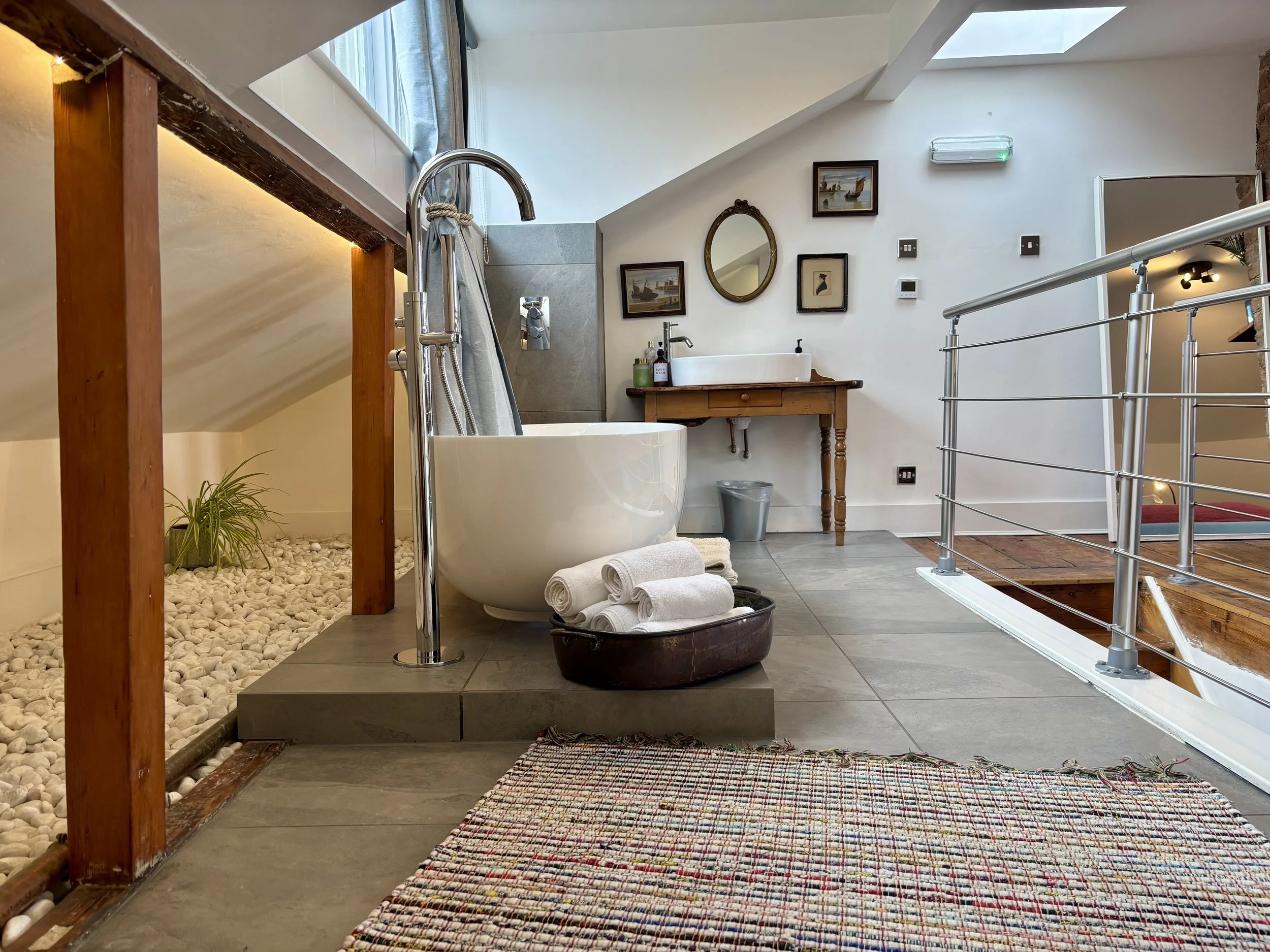 Freestanding bath and shower in Room 101 at Central Victorian House