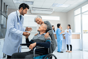 Patient in wheelchair receiving care from doctor