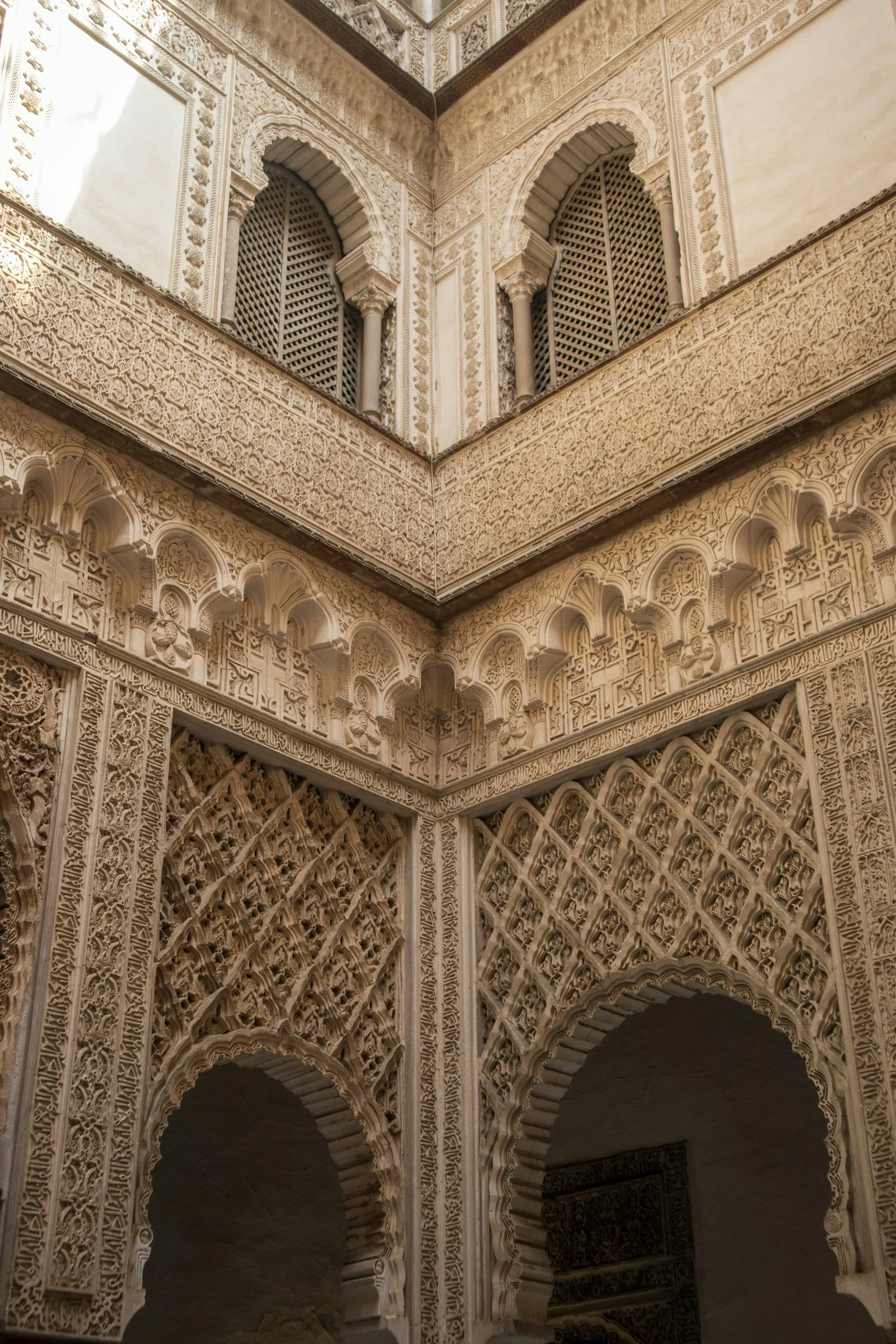 Intricate Islamic architecture with carved details and arched windows.