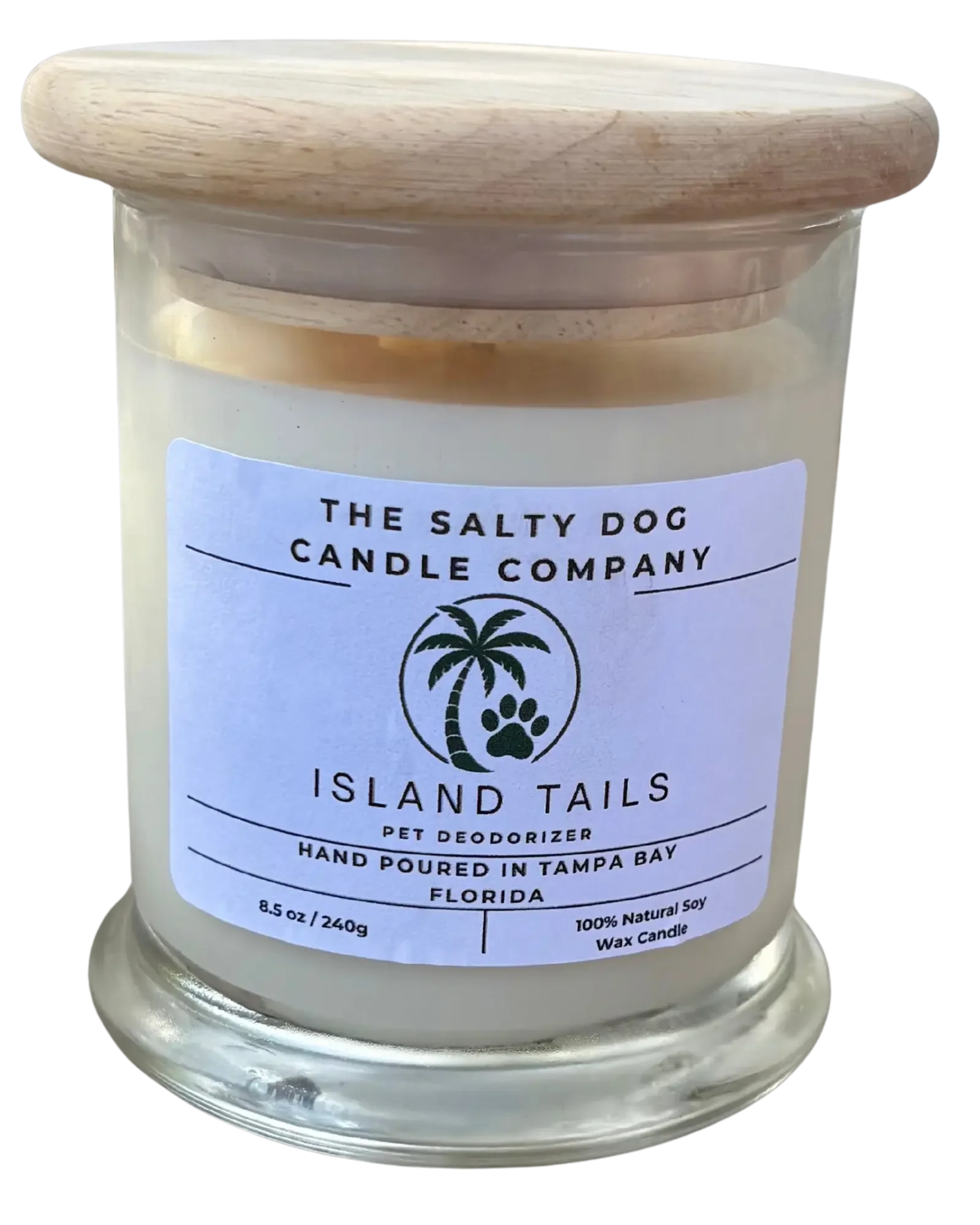 A glass jar of scented candle labeled 'The Salty Dog Candle Company', with a wooden lid. The label indicates it is a pet deodorizer called Island Tails, hand poured in Tampa Bay, Florida, weighing 8.5 ounces.