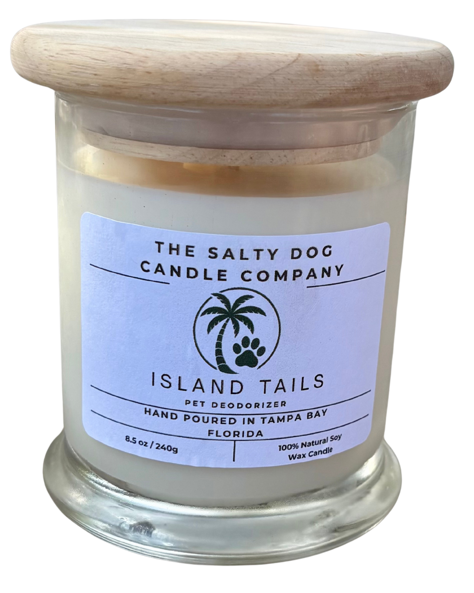 A glass jar of The Salty Dog Candle Company pet deodorizer with a light-colored wooden lid, labeled Isle of Tails, featuring a palm tree and paw print logo, made in Tampa Bay, Florida.