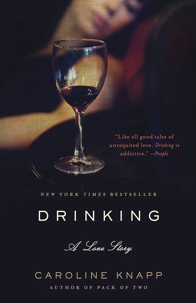 Book cover for "Drinking: A Love Story" by Caroline Knapp, featuring a glass of red wine and a quote about love and drinking.