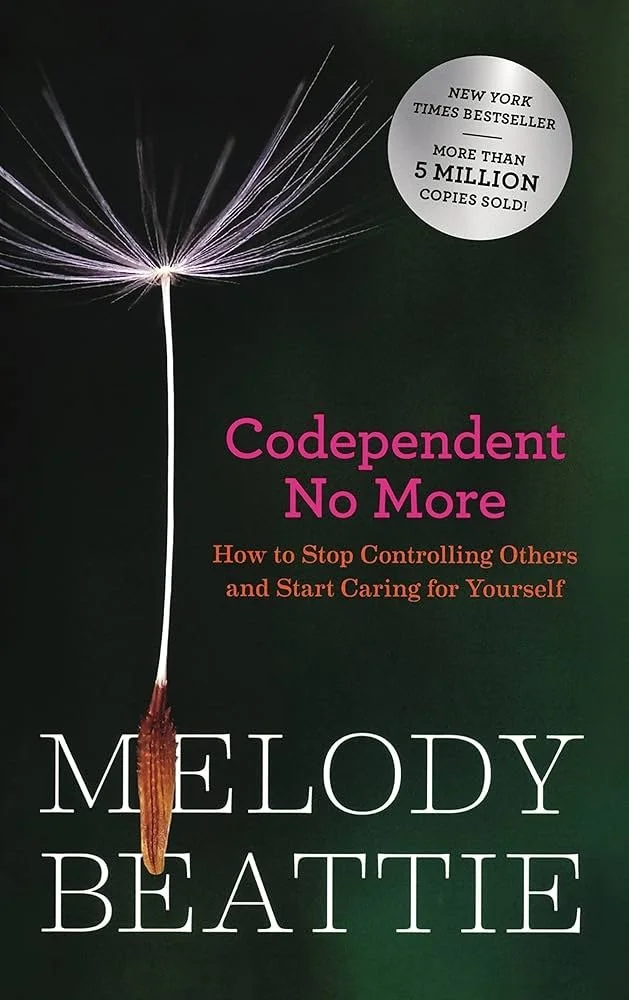 Book cover of 'Codependent No More' by Melody Beattie, with a dandelion seed head against a dark background and a white circular sticker highlighting sales of over 5 million copies.