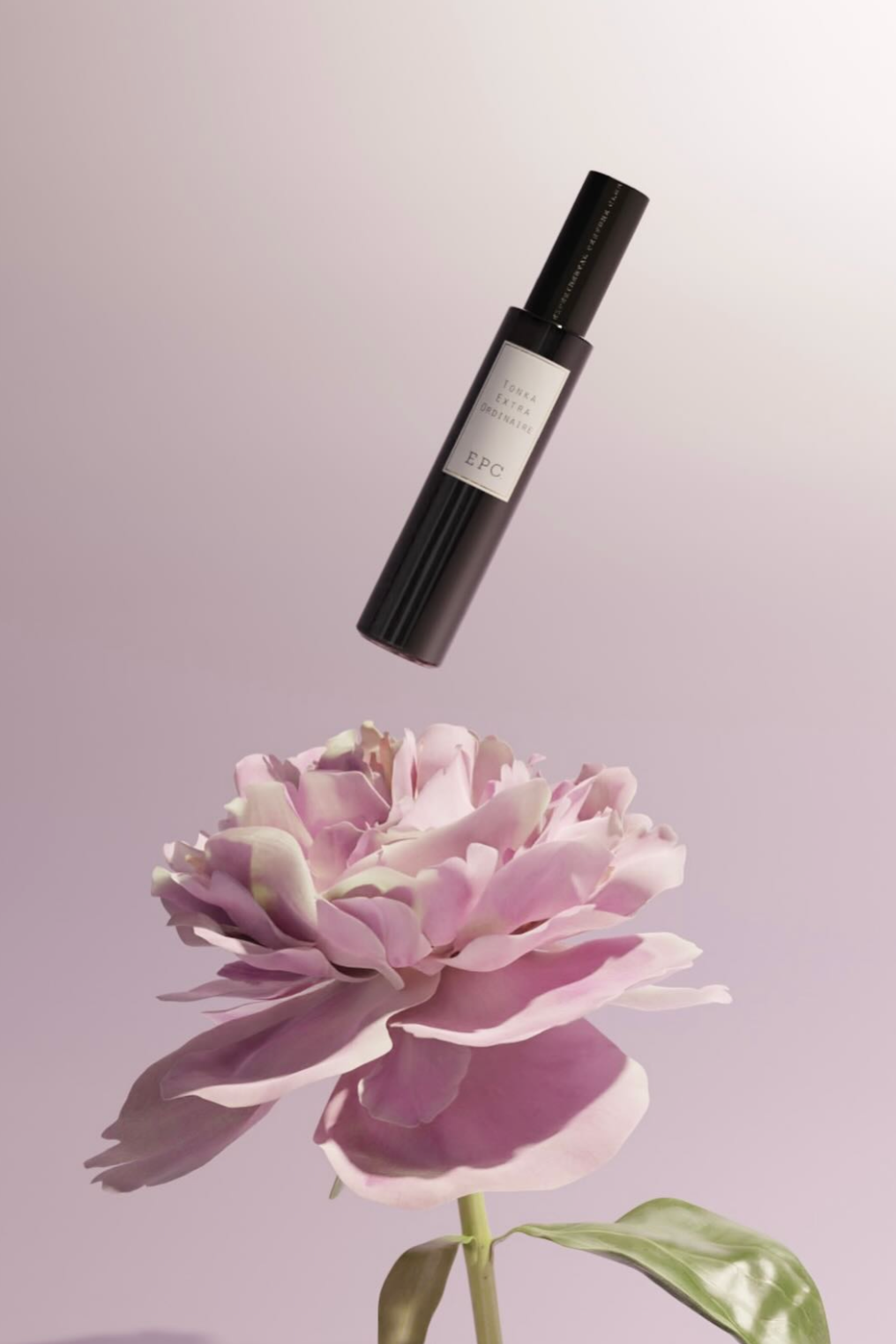 A black spray bottle labeled 'TONAL EXTRA ORDINAIRE EPC' appears to be floating above a pink peony flower on a reflective surface with a pale pink background.