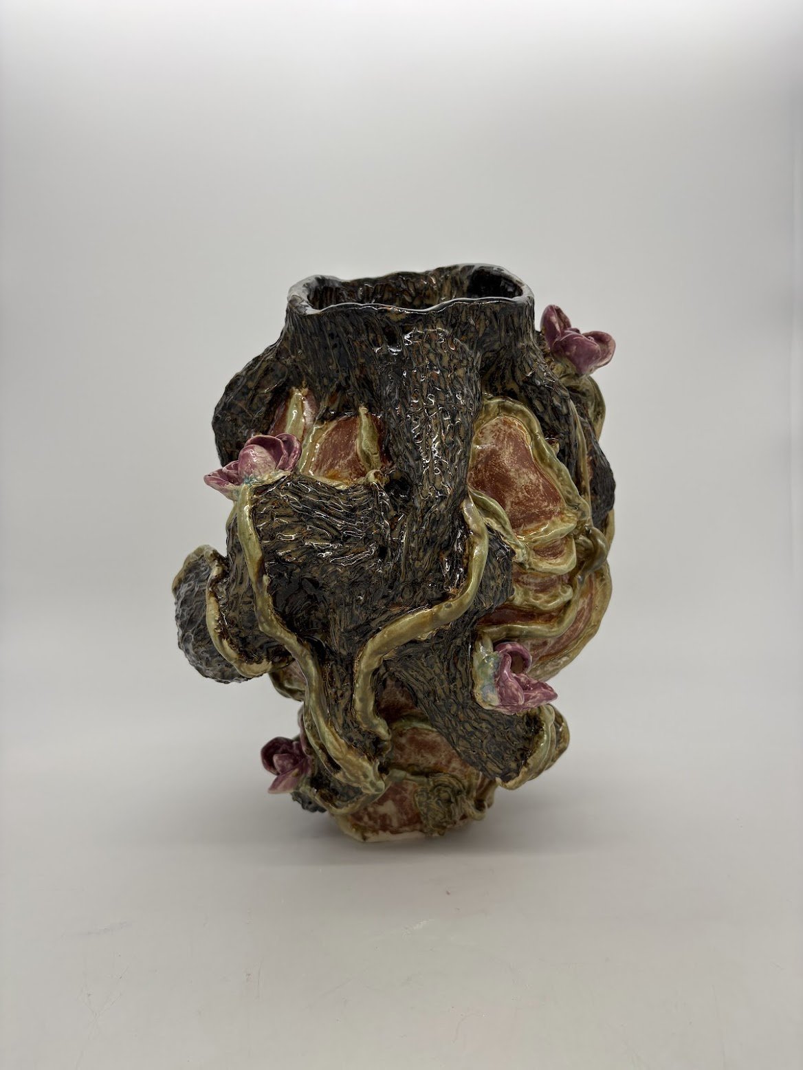 Ensnared [rear view]. B clay and Overglaze. 15.5” x 12” x 13”. 2025.