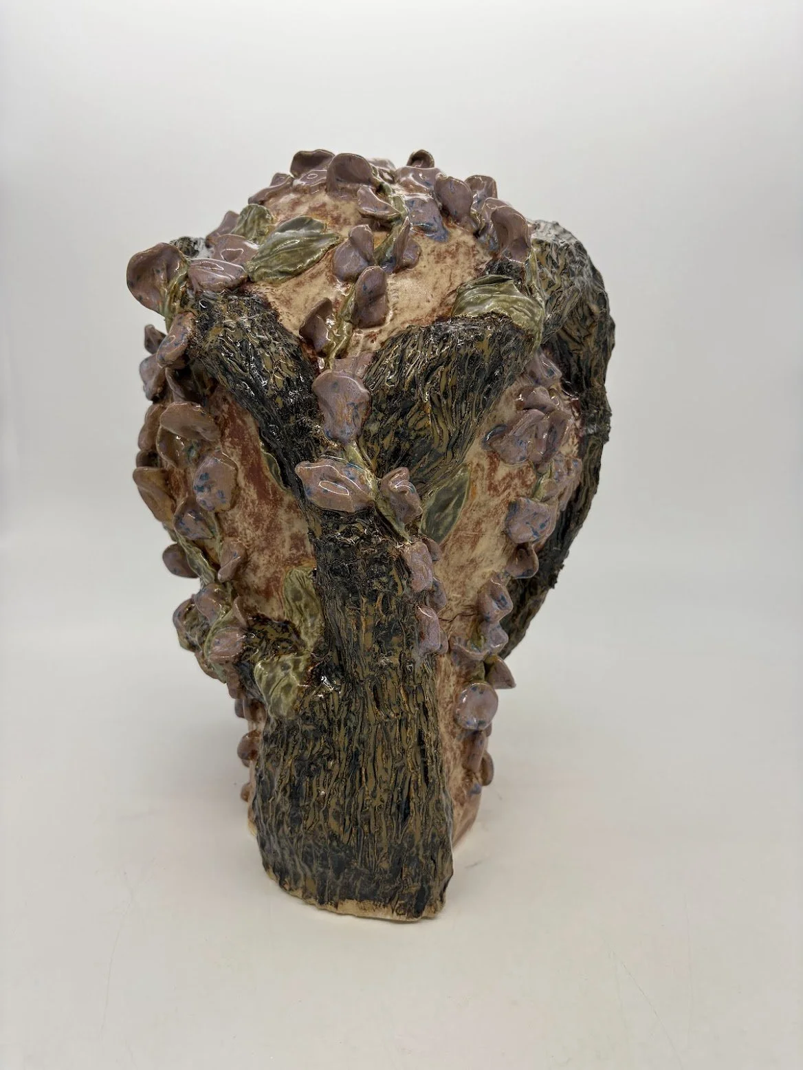 Exchange Participant 2 [rear view]. B clay and Overglaze. 15” x 11.5” x 9.5””. 2025.