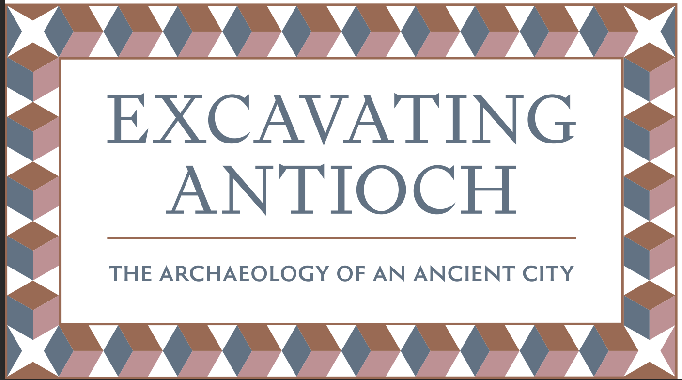 A decorative sign with a geometric patterned border reading 'Excavating Antioch' and 'The Archaeology of an Ancient City.'