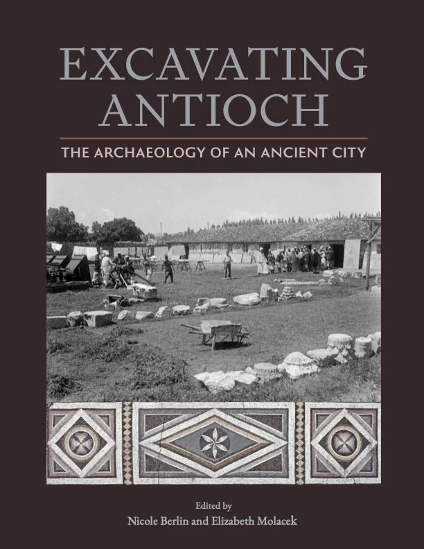 Book cover titled "Excavating Antioch: The Archaeology of an Ancient City" edited by Nicole Berlin and Elizabeth Molacek, featuring a black-and-white photo of archaeological excavation activity with workers and tools, and decorative tile patterns at the bottom.