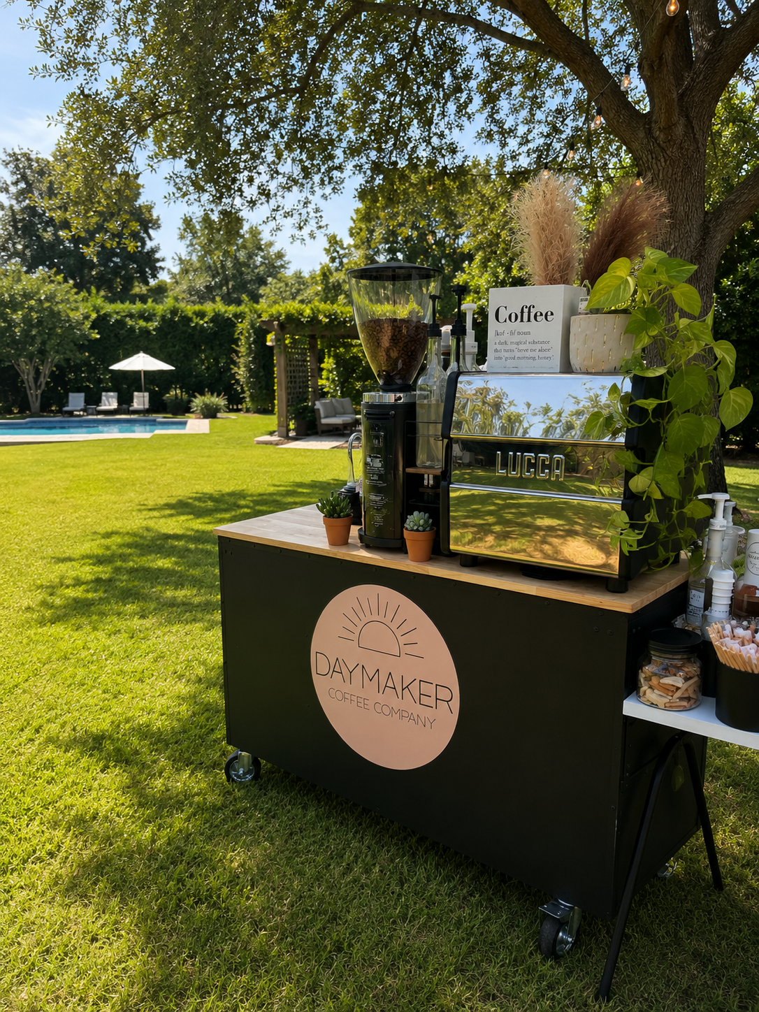 Outdoor mobile coffee cart catering setup by Daymaker Coffee Company at a private backyard event