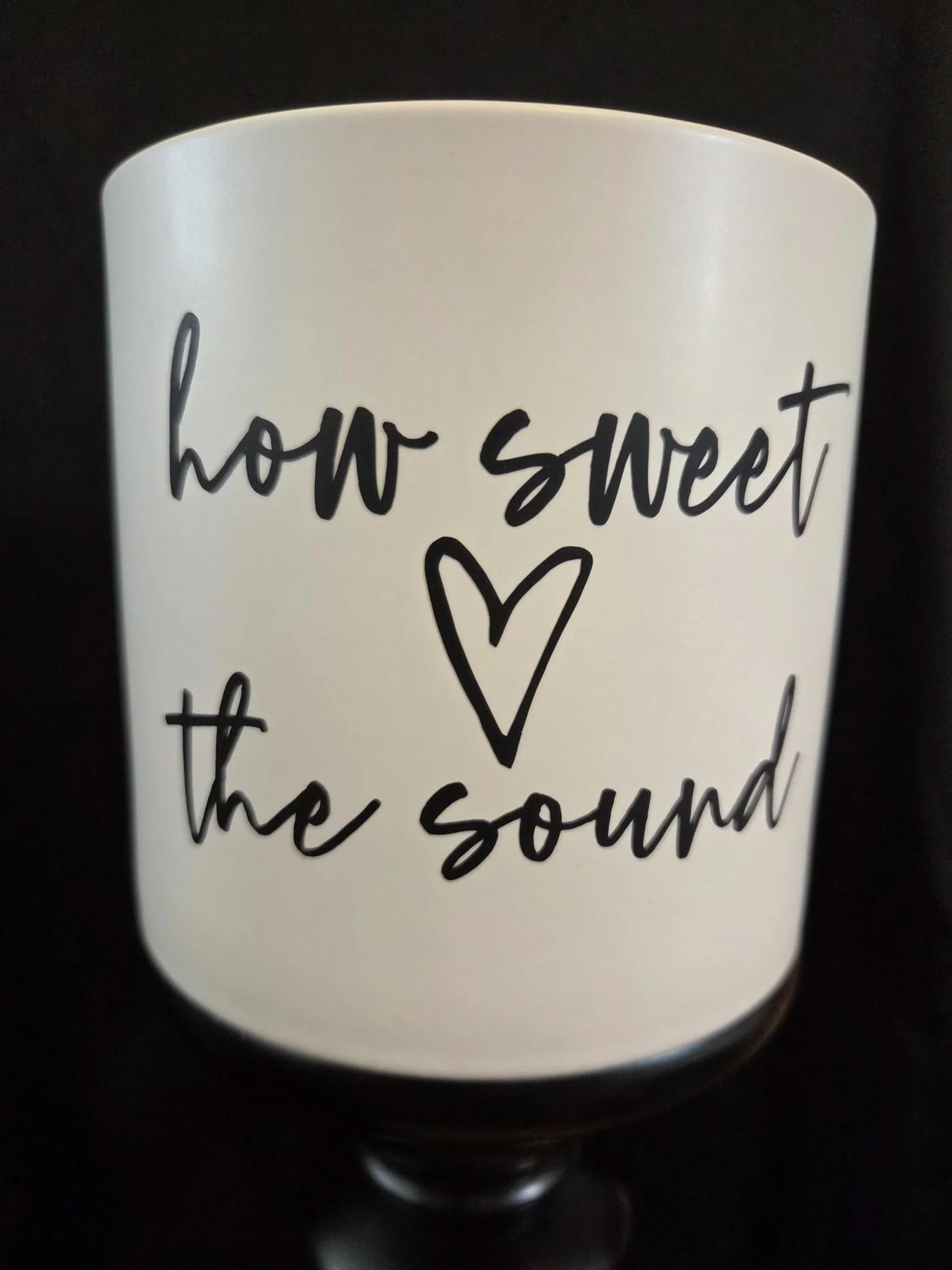 White ceramic planter featuring "Amazing Grace" with a butterfly on the front and "How Sweet the Sound" on the reverse, complete with a drainage hole and ceramic tray.