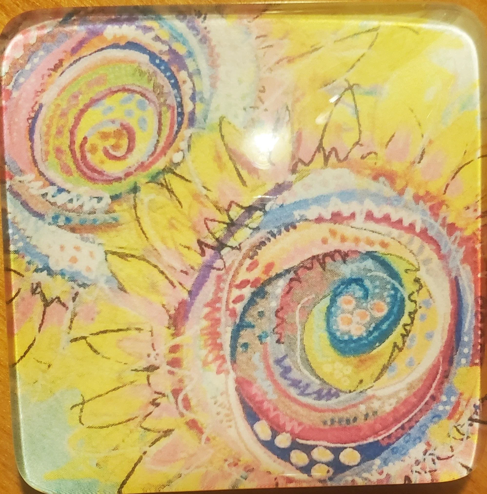 Handmade square glass magnet featuring colorful abstract sunflower artwork in a vibrant bohemian style.