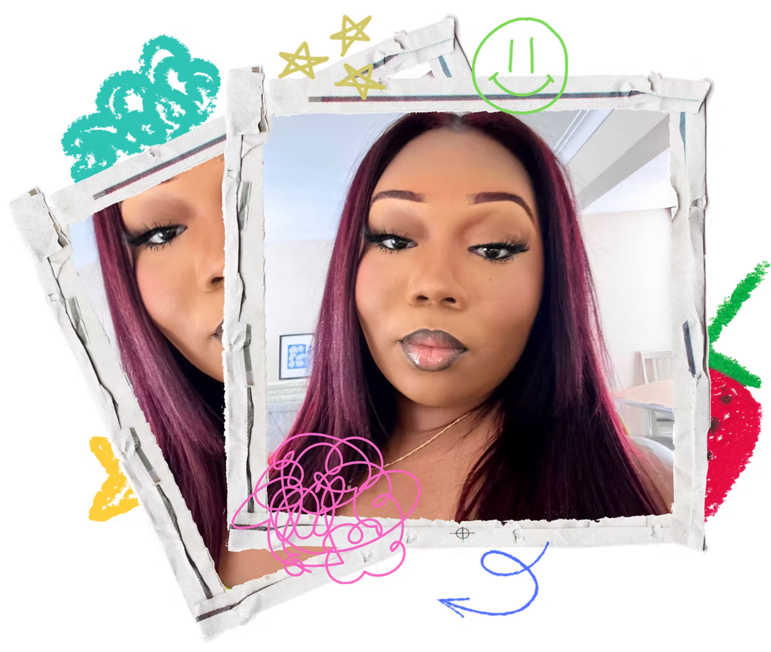 A woman with long burgundy hair taking a selfie in front of a mirror adorned with yellow, blue, pink, green, and black doodles and graphics.