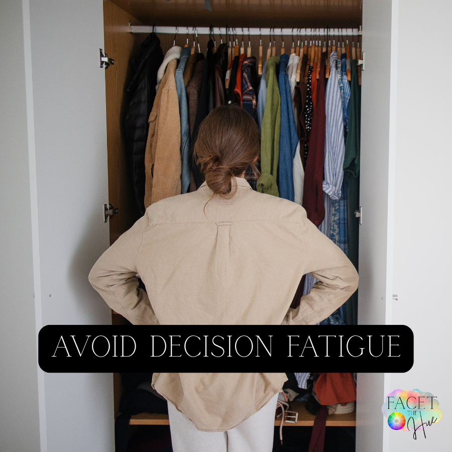 A person with brown hair tied in a bun, wearing a beige shirt, stands in front of an open closet filled with hanging clothes. The person is seen from behind with their hands on their hips. The image includes a text overlay that reads 'Avoid Decision Fatigue', and there is a small logo in the bottom right corner that says 'Facet the Hue' with multicolored design elements.