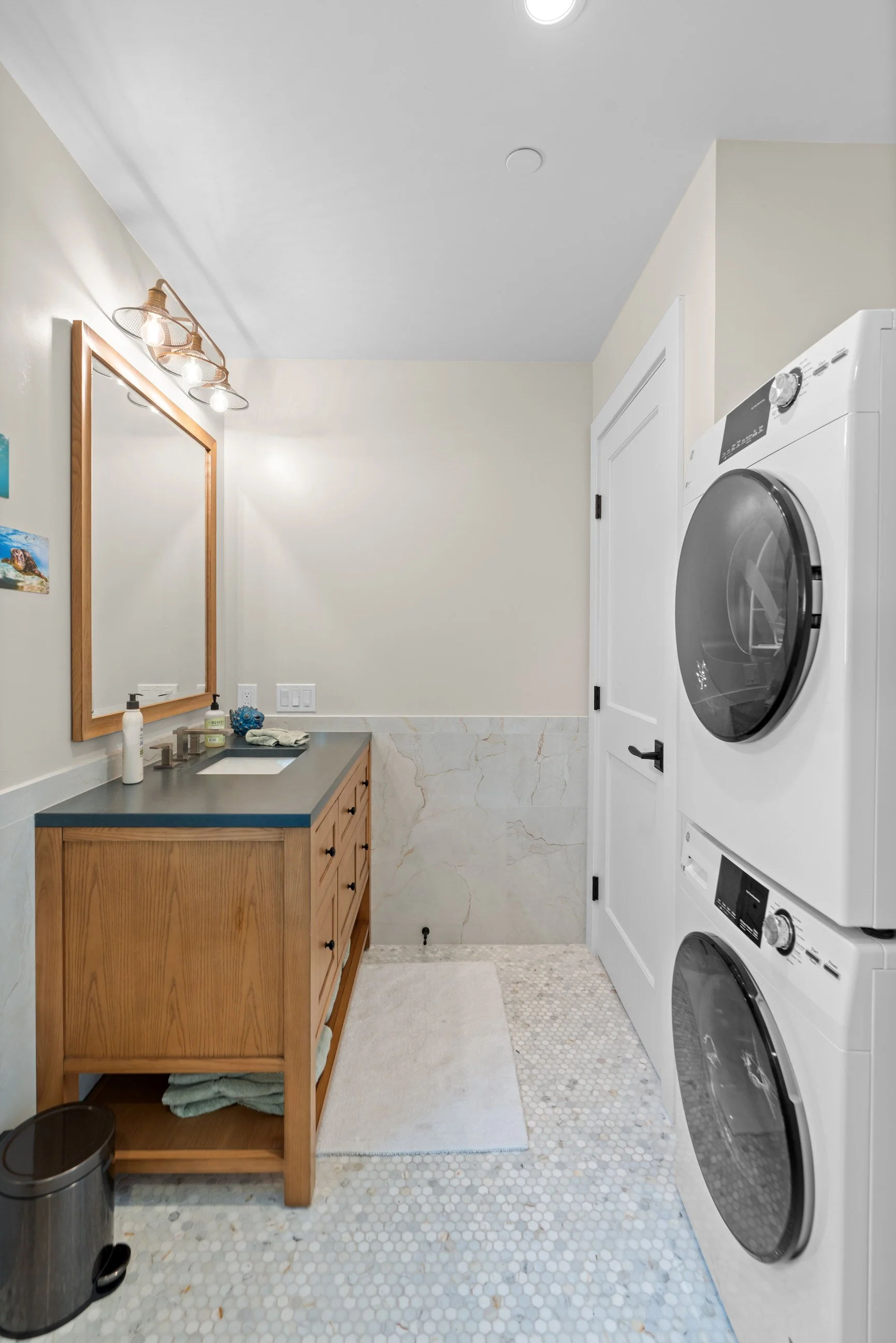 Compact bathroom with stackable washer dryer and vanity