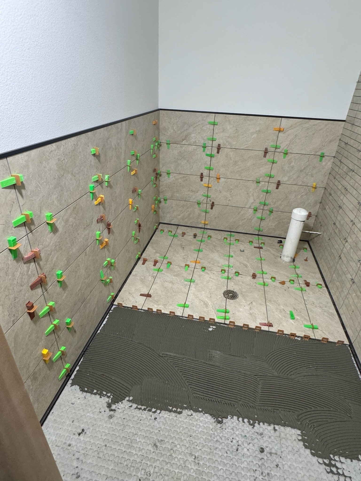 Modern bathroom remodel with tile flooring and shower tile