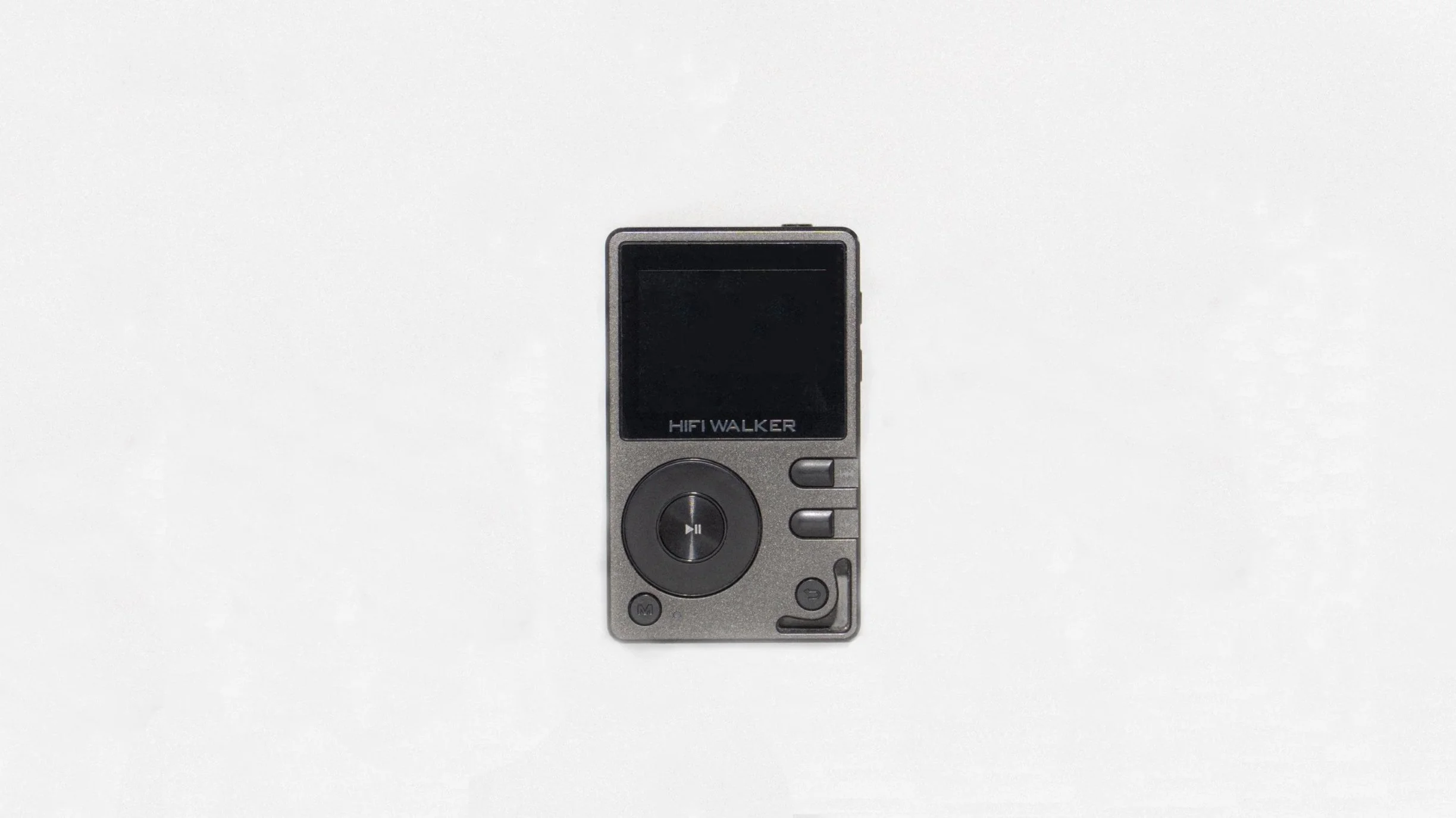 A portable black MP3 player with silver buttons, labeled 'HIFI WALKER', placed on a white surface.