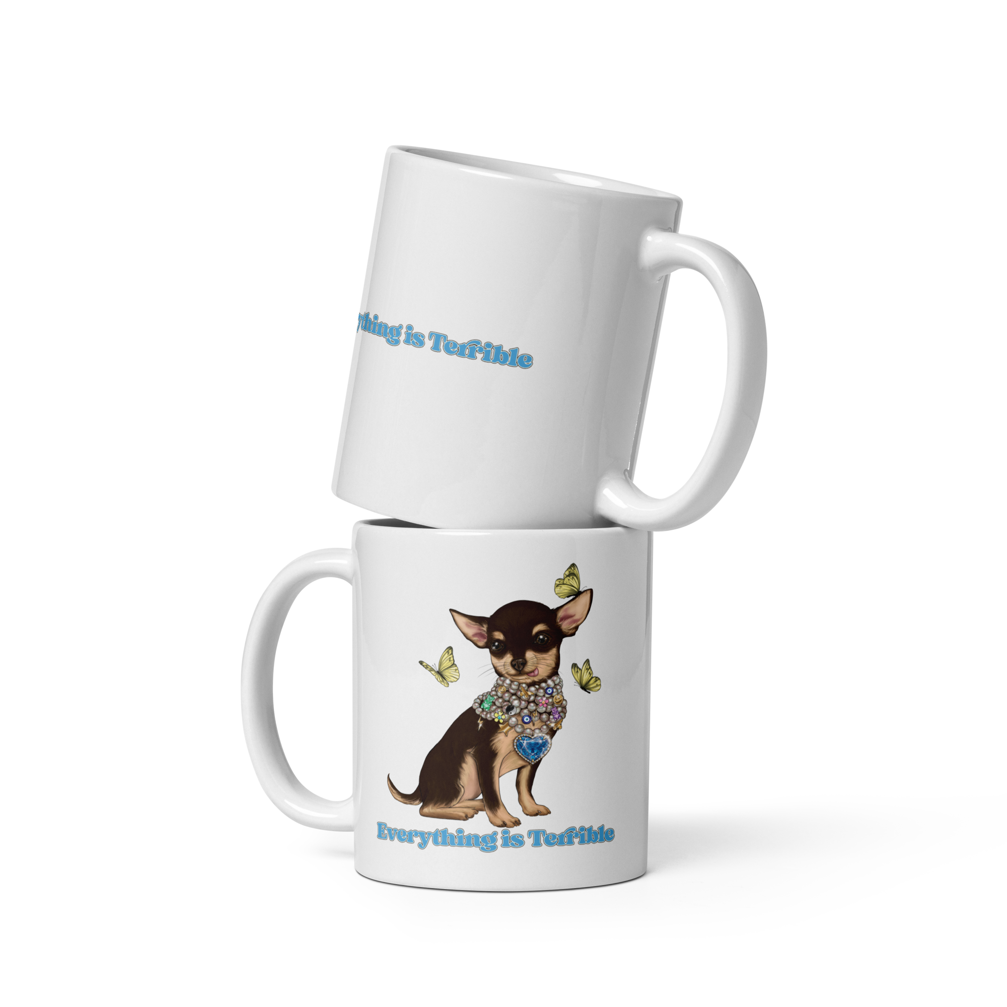 White coffee mug with a graphic of a small dog adorned with jewelry and butterflies, along with the text "Everything is Terrible" and "Nothing is Terrible."