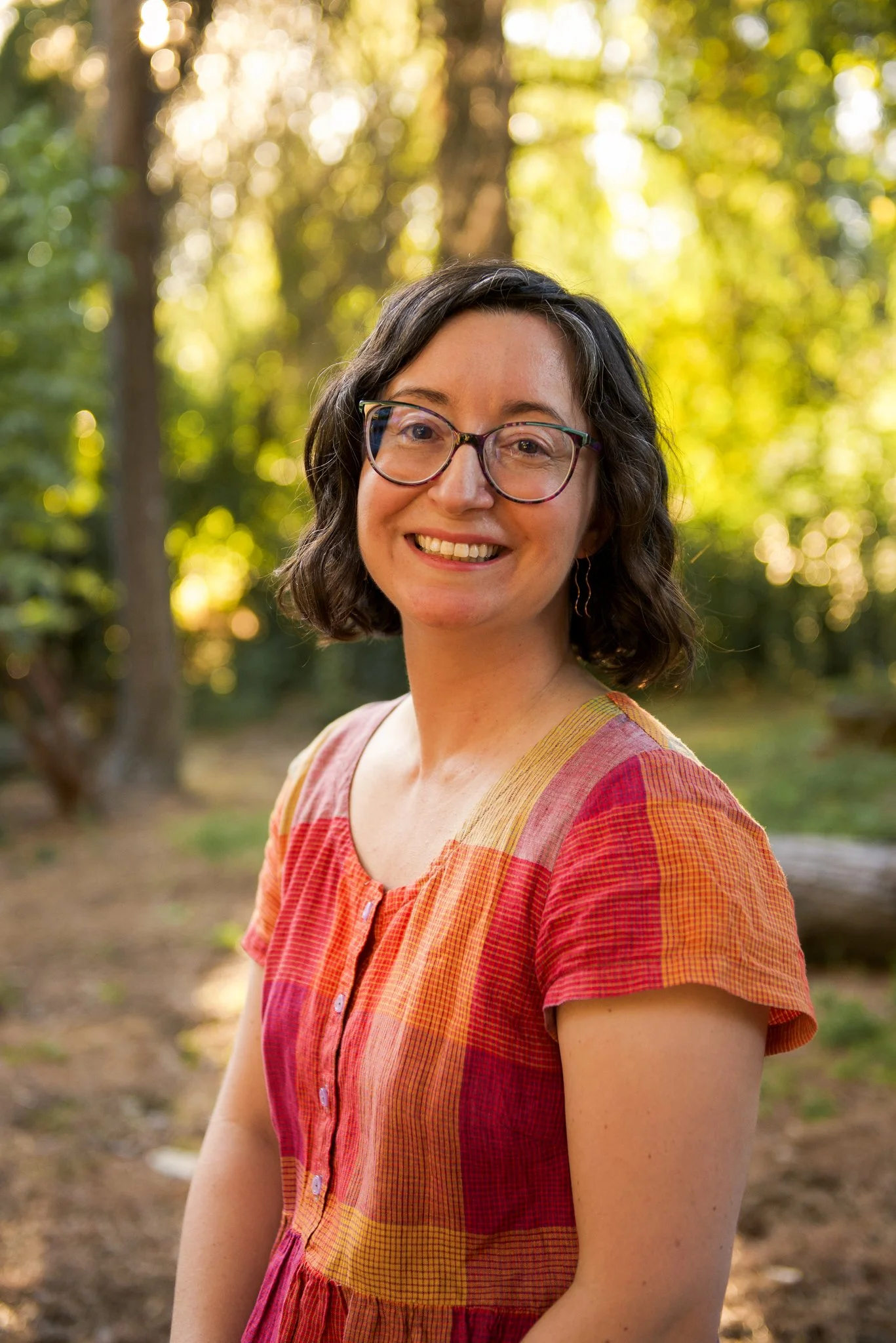 Rebecca Huval, grief therapist, poses for a photoshoot in the Sacramento State Arboretum.