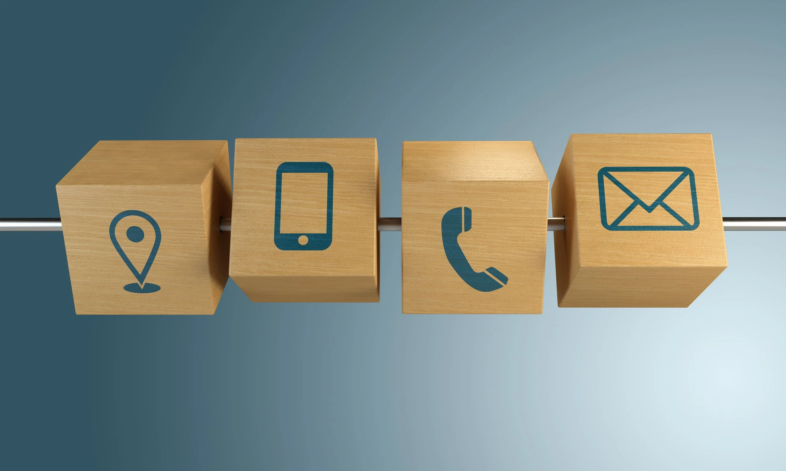wooden blocks displaying contact icons