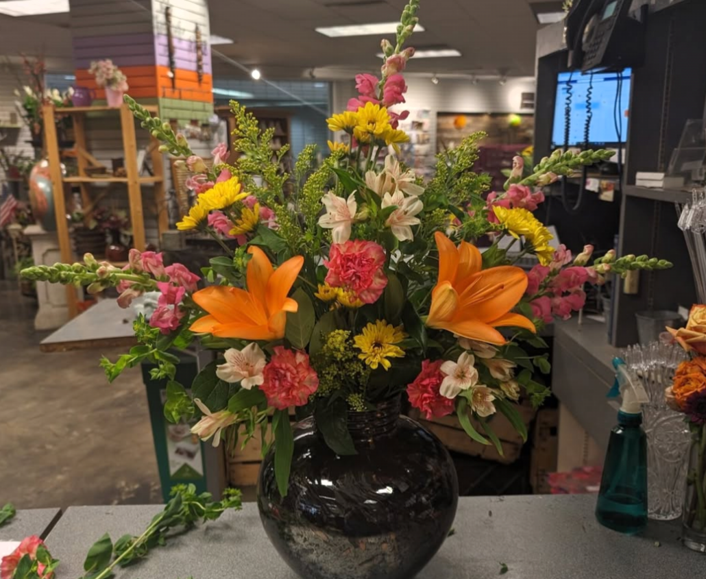 Front Facing - snapdragon, carnations, lilies, daisy mums, alstroemeria, solidago, salal & burp