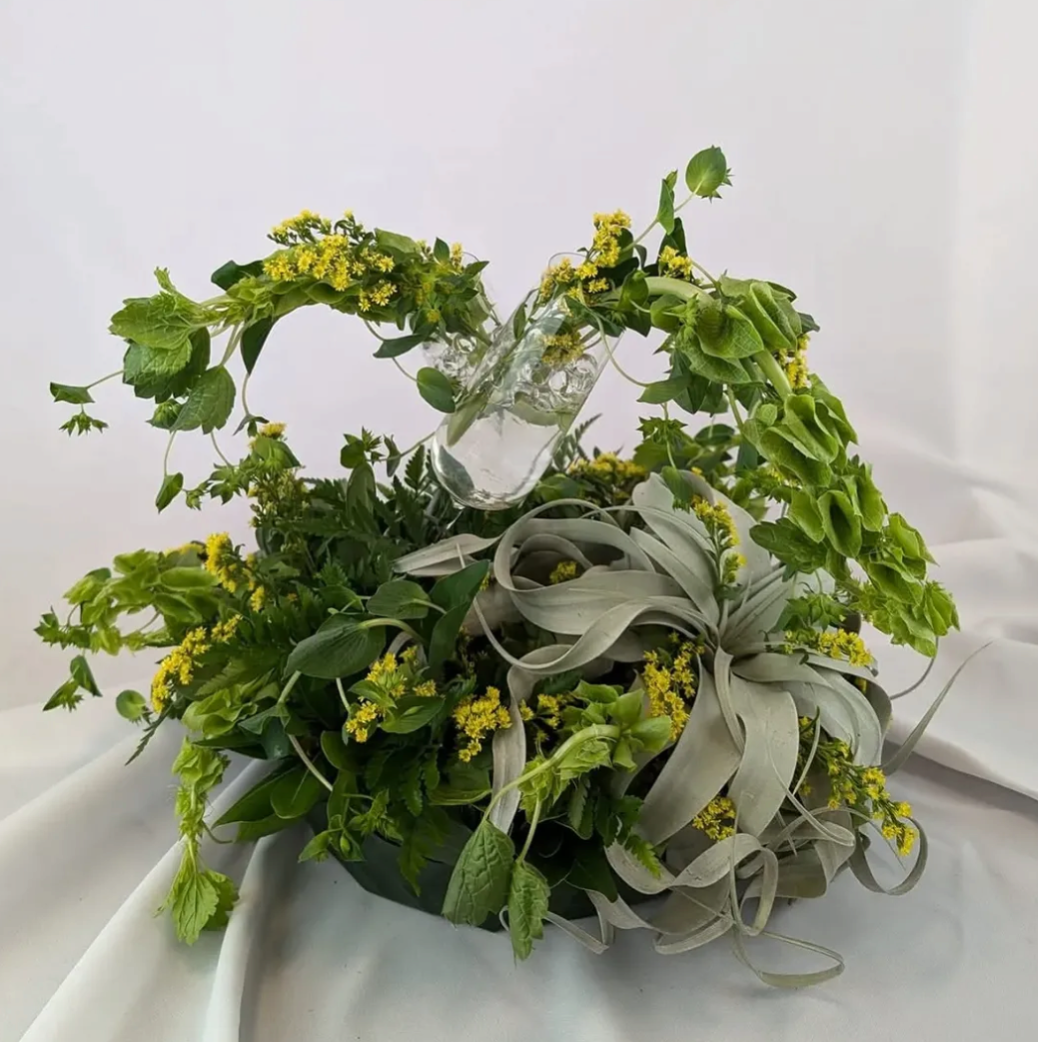 2024 State Fair Blue Ribbon Winner - Raise Your Glass by P!NK

tillandsia, bells of ireland, solidago, myrtle, leatherleaf & water beads