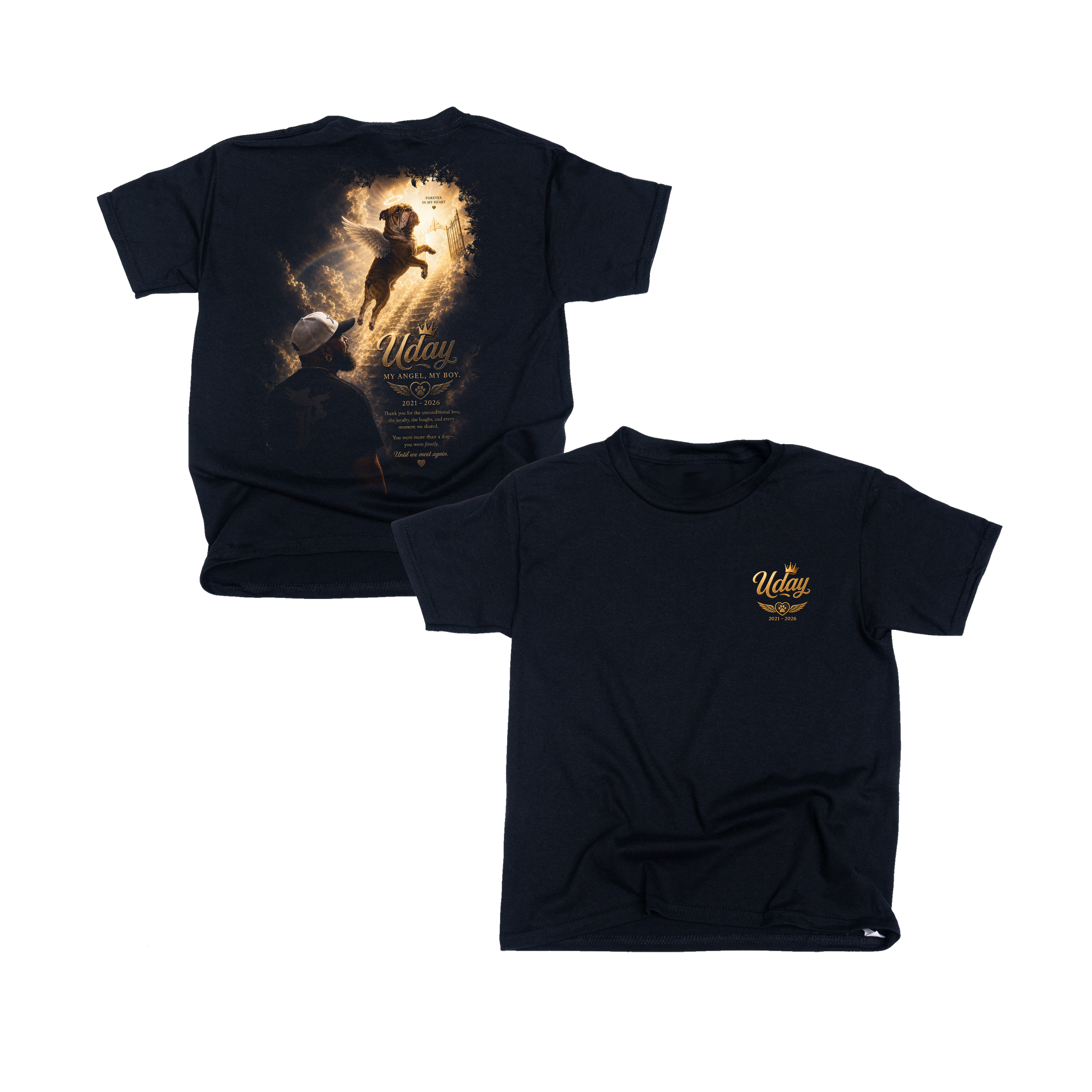 A navy blue t-shirt featuring an artistic design of a dog with angel wings flying over clouds, a halo, and a rainbow, with heartfelt text memorializing Uday, who lived from 2021 to 2026.