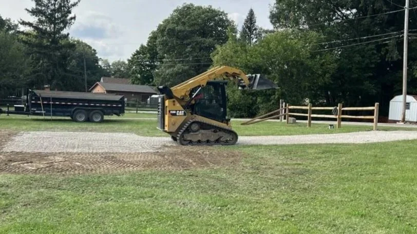 Cat Skid Steer grading gravel