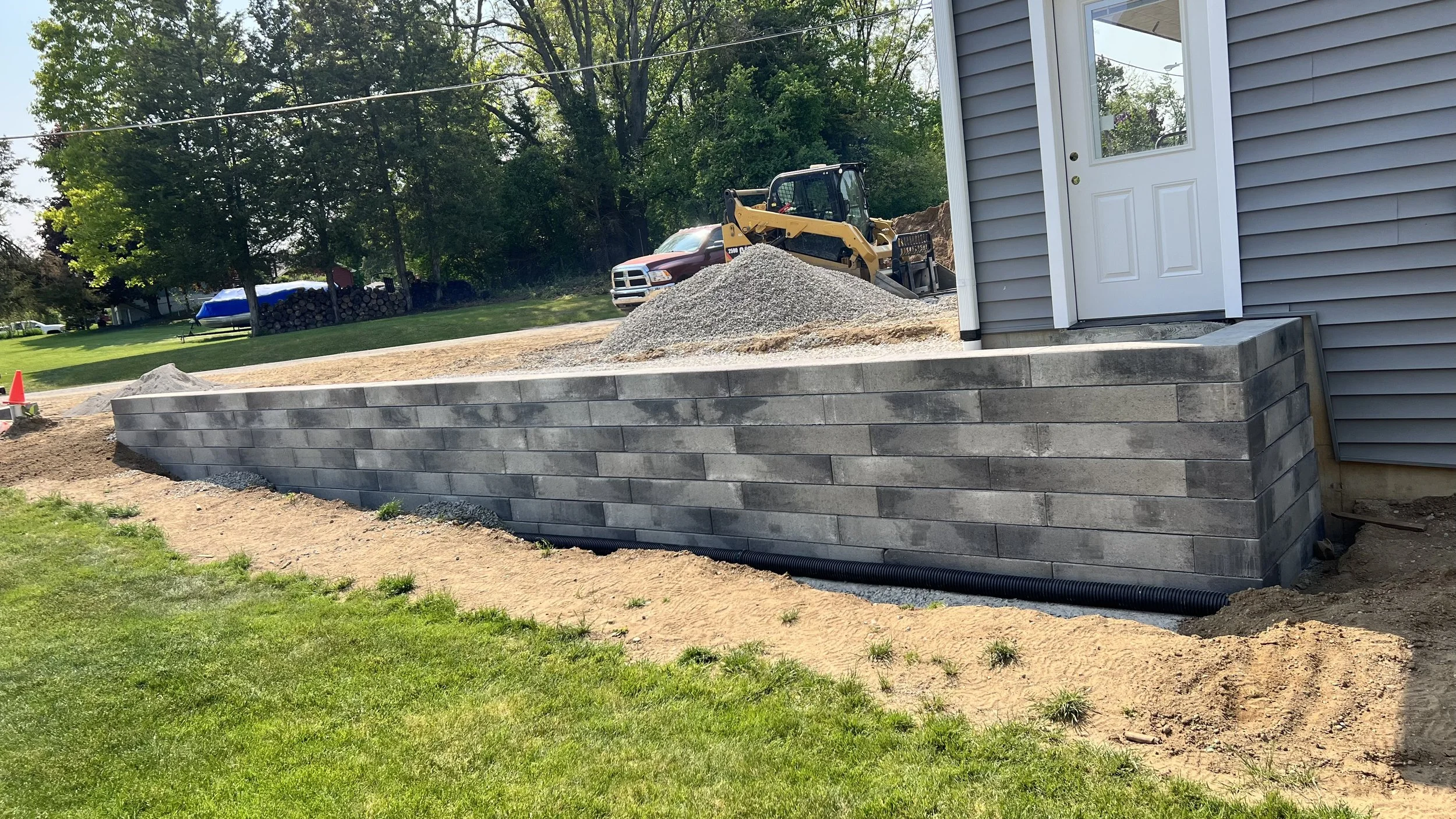 After large format retaining wall construction