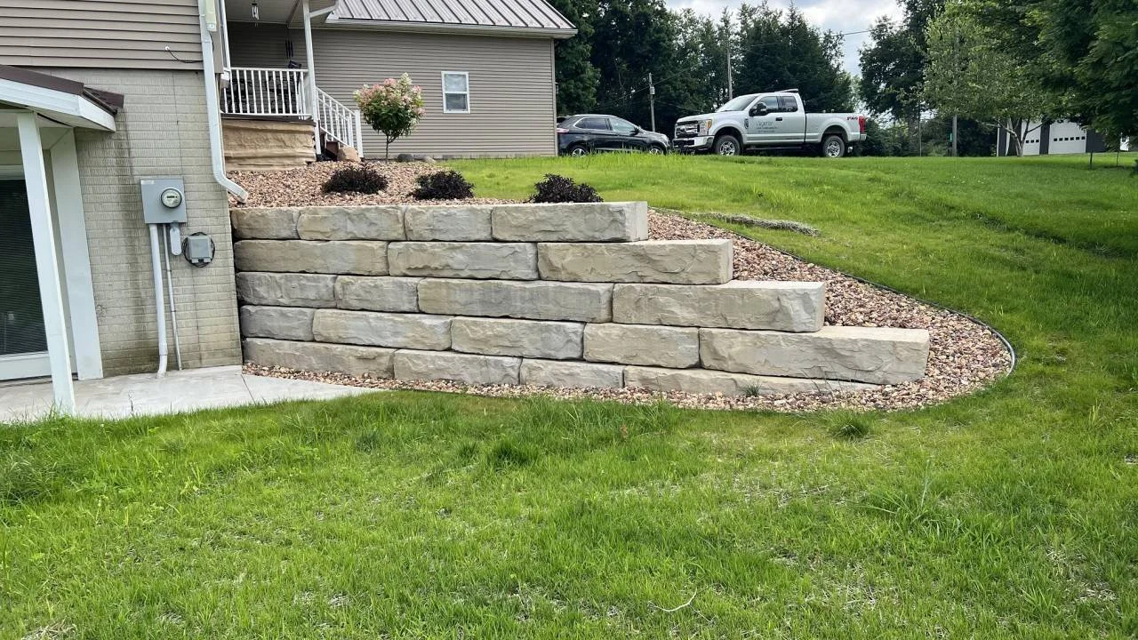 After large format retaining wall construction