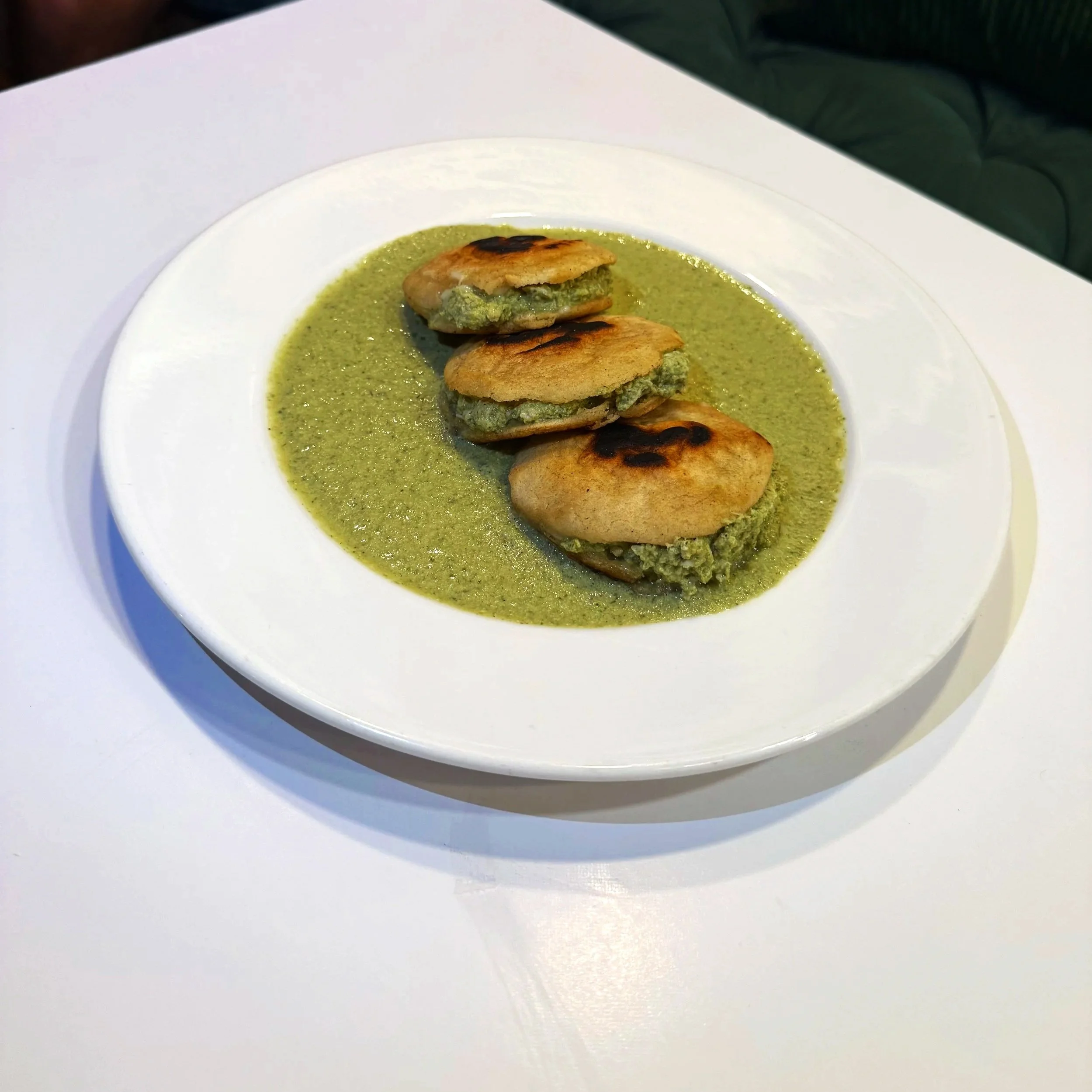 Hand-made gorditas filled with chicken and cheese. Bathed in our house favourite Pipian Sauce