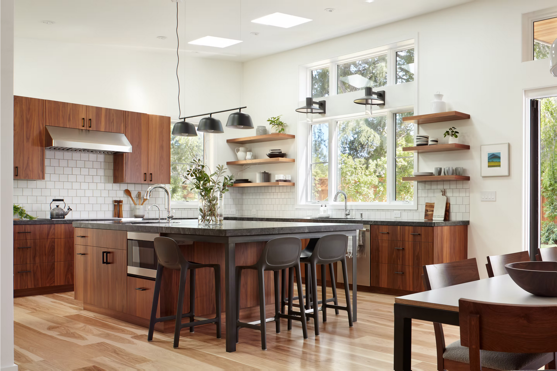 Modern kitchen design with dark wood and metal