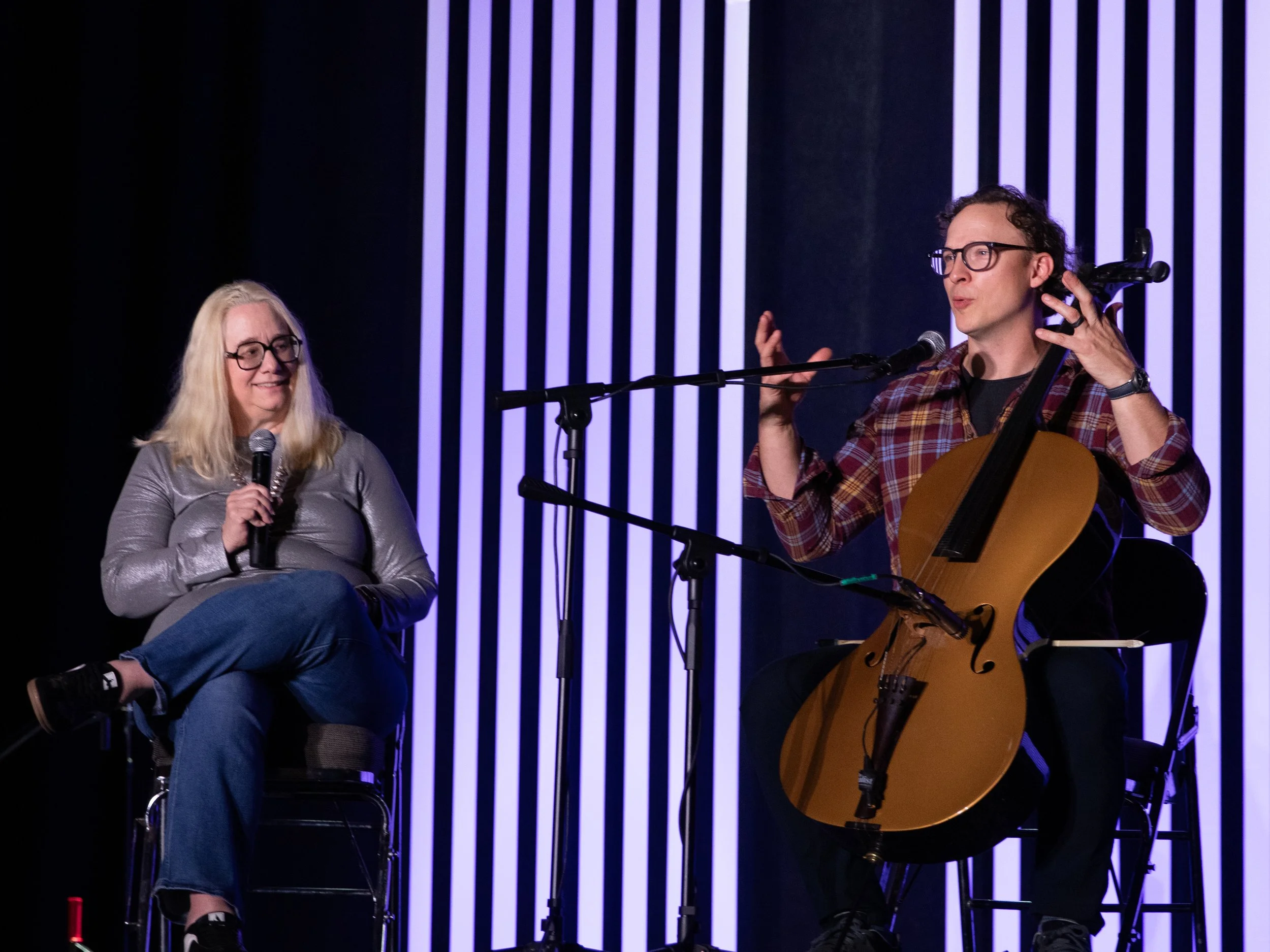 Live musical performance featuring vocalists and musicians on stage, entertaining an audience during a special event.