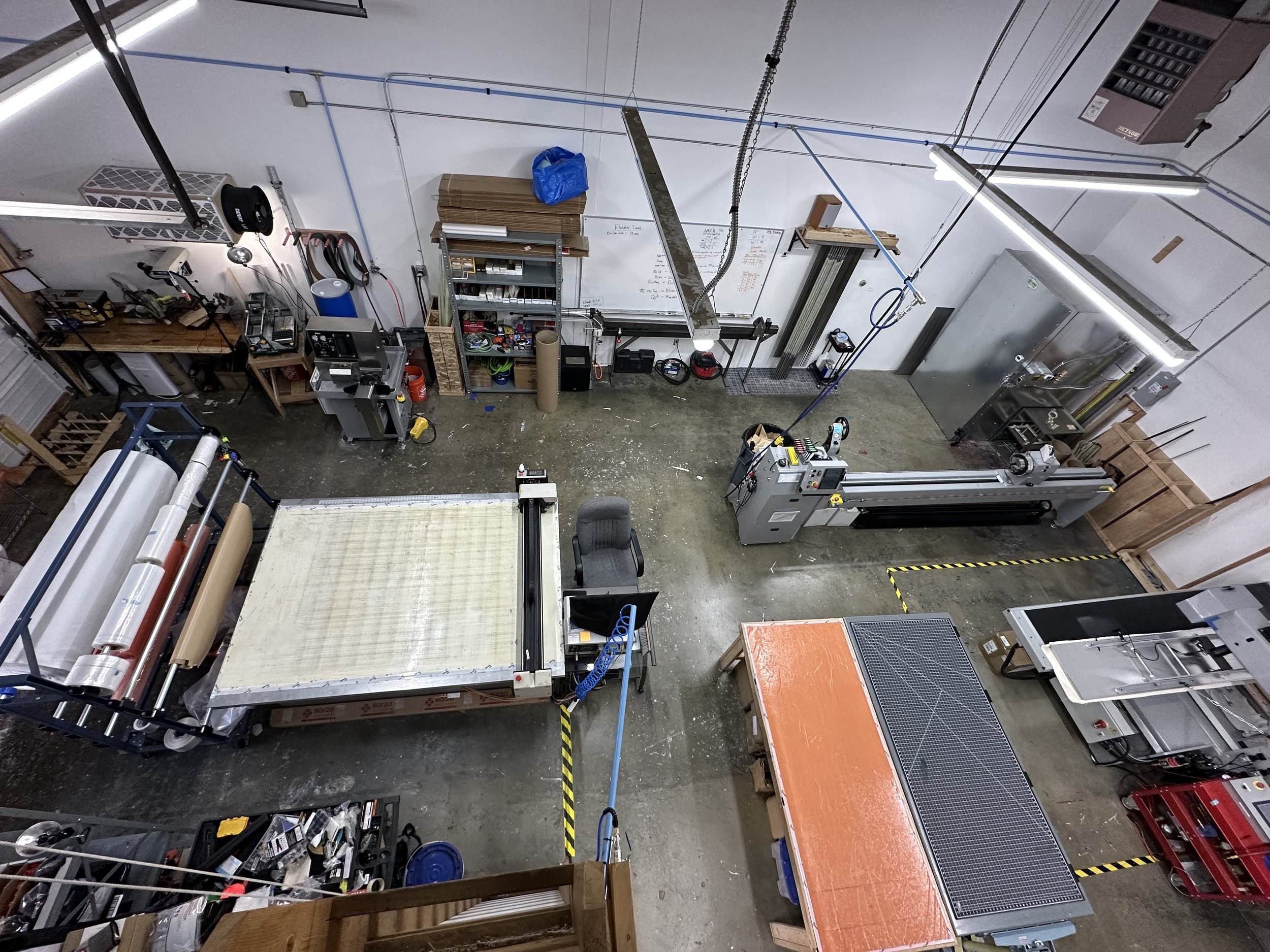Key equipment shown: mandrel extractor, wet sander, CNC ply cutter