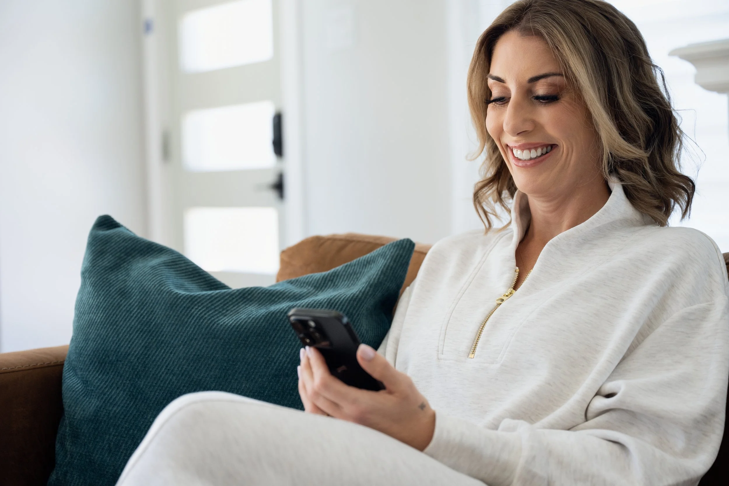 women chatting on cellphone or looking at email.