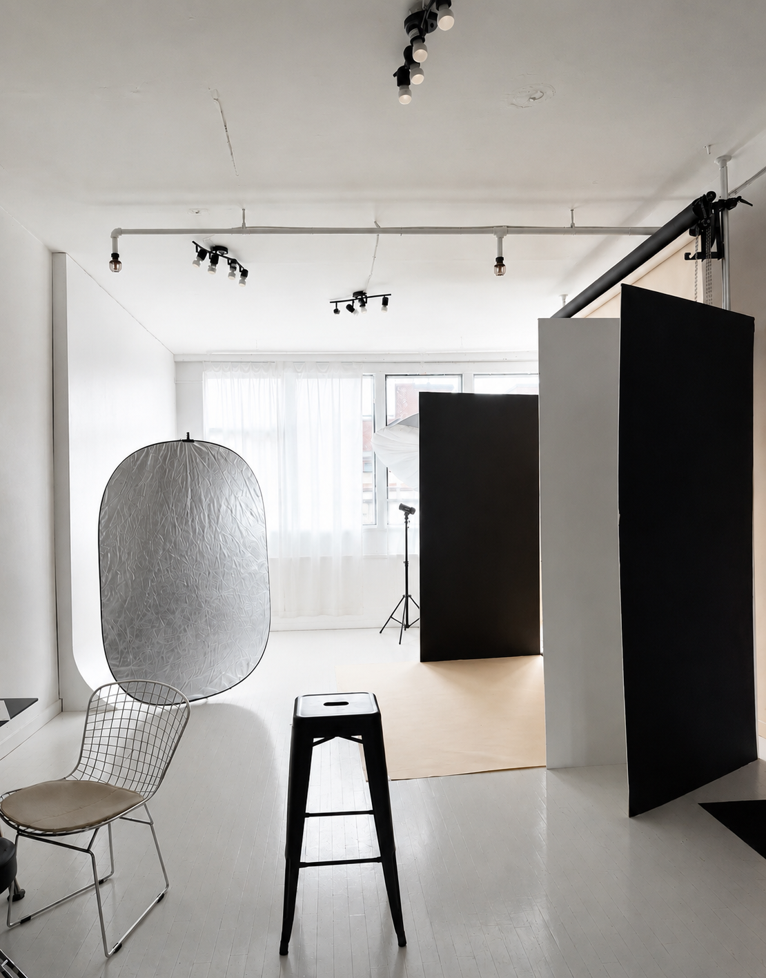 Photography studio with backdrops and lighting equipment.