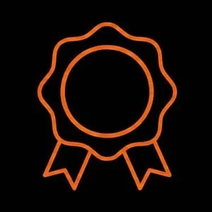 Orange award or badge icon with a circular center, wavy outer border, and two ribbon tails at the bottom, on a black background.